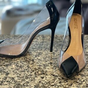Black 4” stiletto heels by Schutz. Like new-no signs of wear on heels.